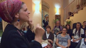 Chaya Lester performs spoken word (Jerusalem). Photo from Shekinah Rising